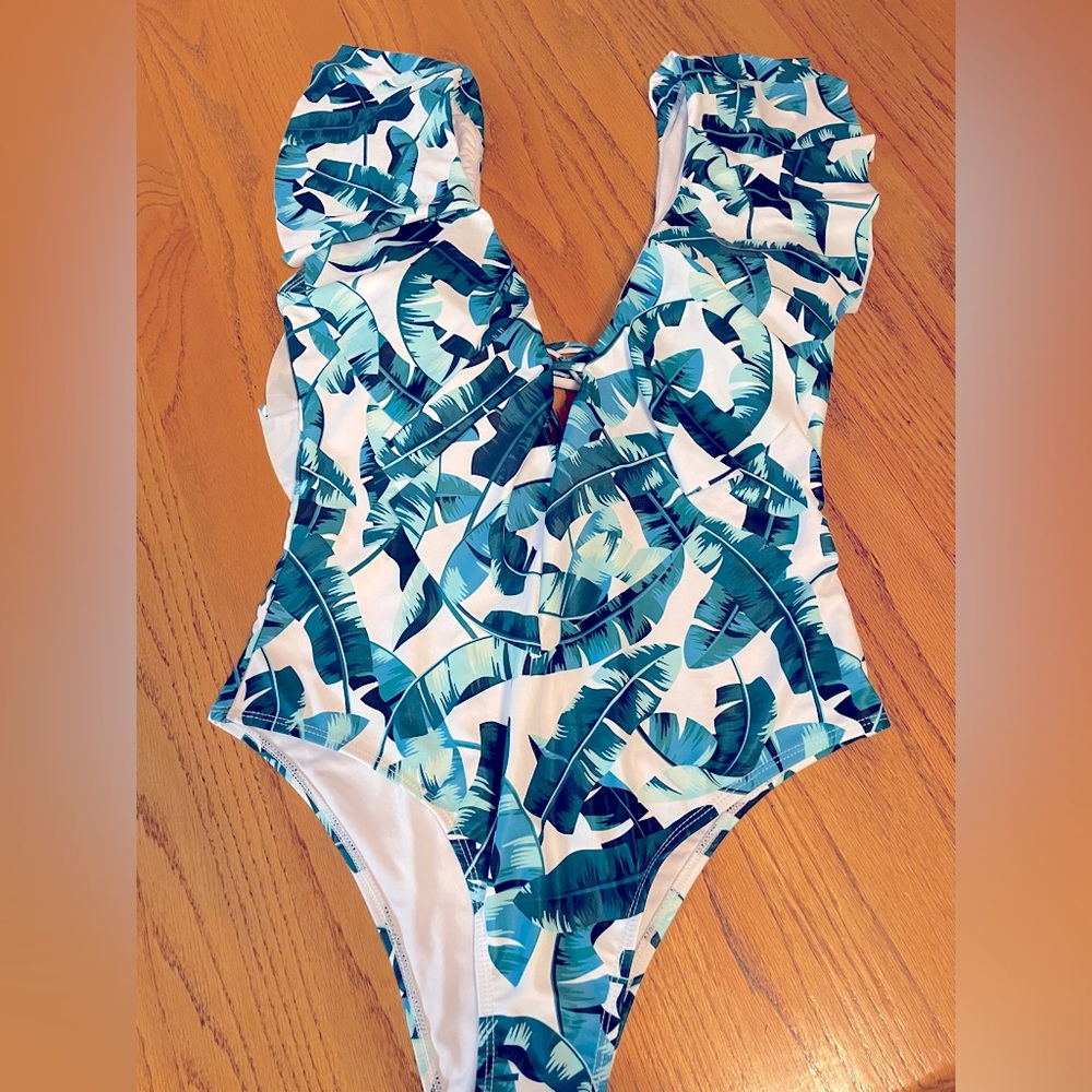 1 Piece size XL high rise swimsuit. Plunging neckline down to mid chest.